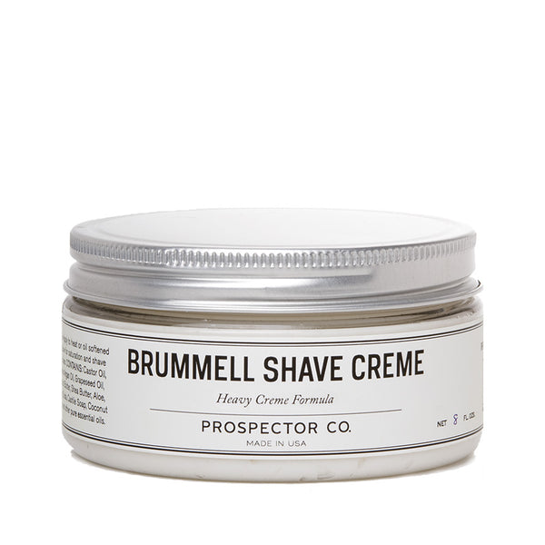 A circular container of product with silver cap and cream-colored ingredients label.