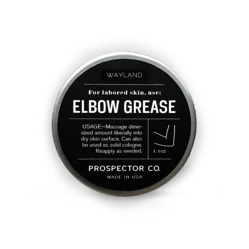 A circular metal tin of product with silver cap and black-colored ingredients label.